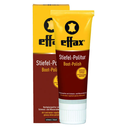 Die schwarze Effax Stiefel-Politur in der 75 ml Tube steht vor ihrer originalen Papp-Umverpackung. Beide zeigen die Produktbeschriftung für die wasserabweisende und schmutzabweisende Hochglanzpolitur. Diese Glattlederpflege mit integriertem Schwammaufträger eignet sich ideal für schwarze Lederreitstiefel, Reitschuhe, Zaumzeug und Taschen.